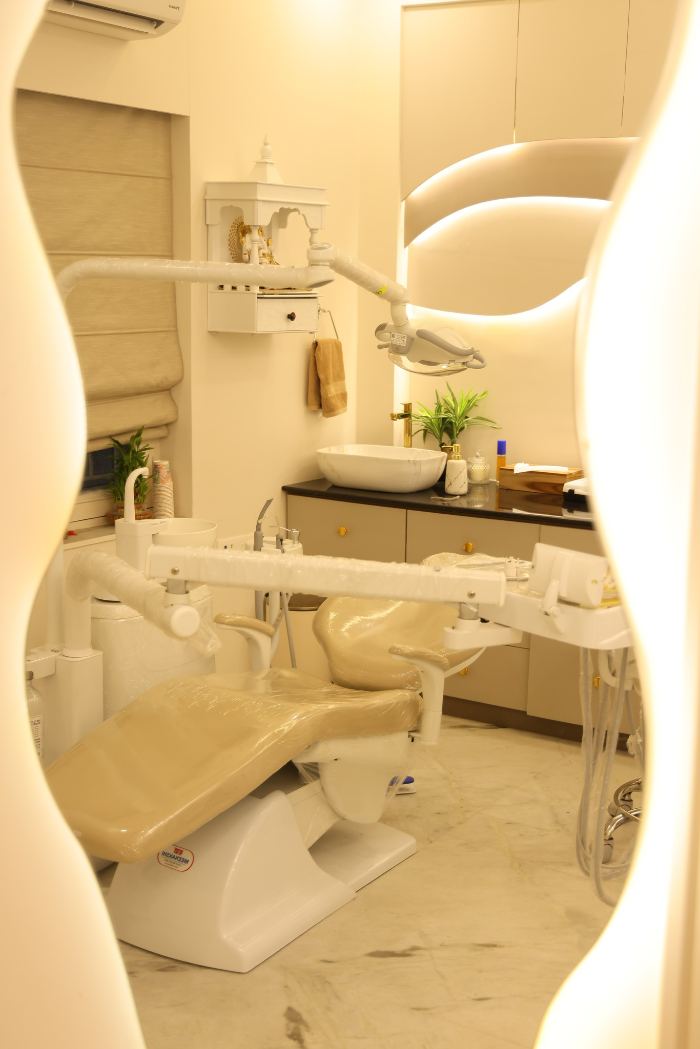 Toothique treatment room with dental chair and overhead light